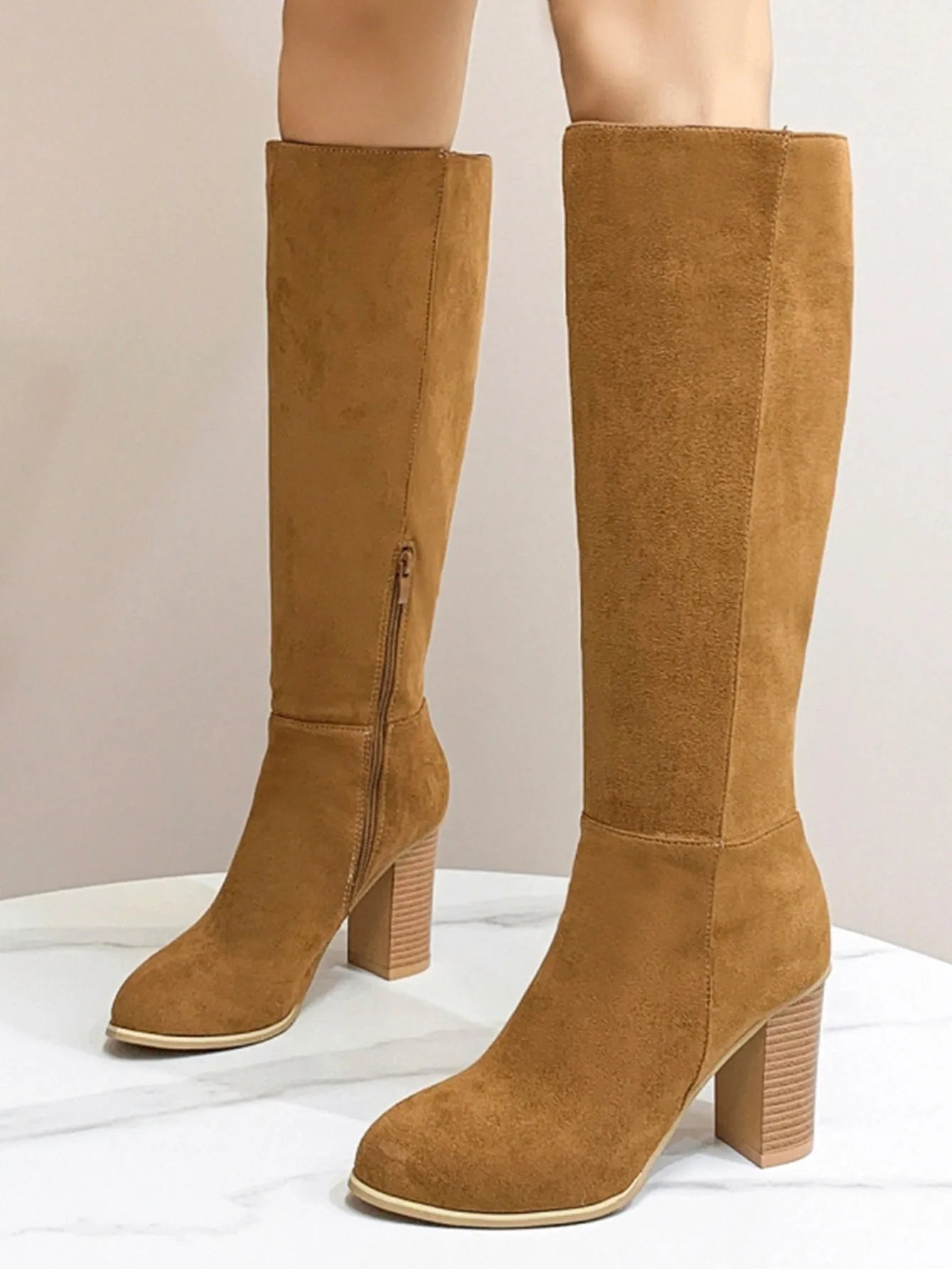 Women's square toe high heel fashion boots in black and dark brown colours showing front view