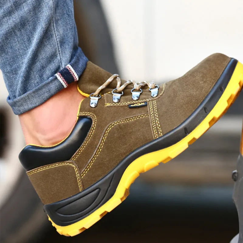 Bronze coloured low-cut leather safety boots with a steel toe cap and textured anti-skid sole.