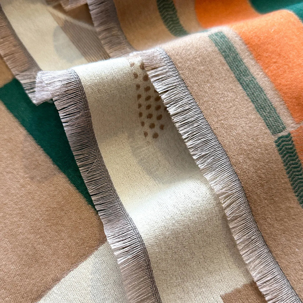Long beige cashmere-like polyester scarf in a European chic style, laid flat to show its 185cm length.