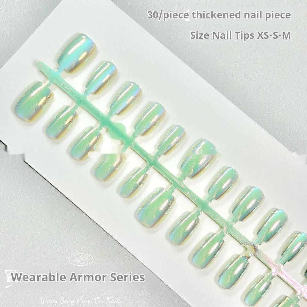 Set of electroplated Cat's Eye false nails with aurora armour finish in short ladder shapes, sizes XS, S, and M.