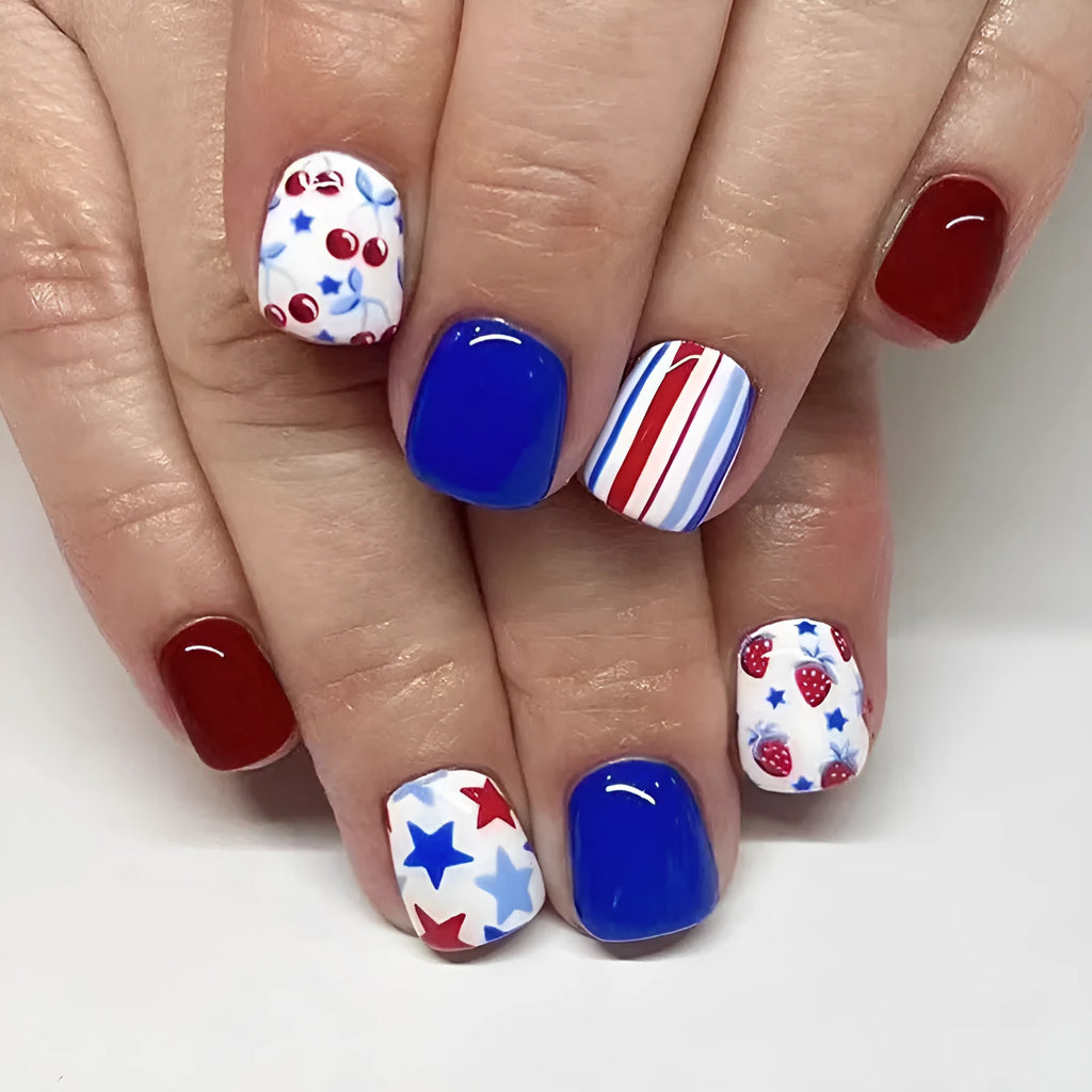 Short glossy false nails with red and blue strawberry cherry pattern, 24 piece set.