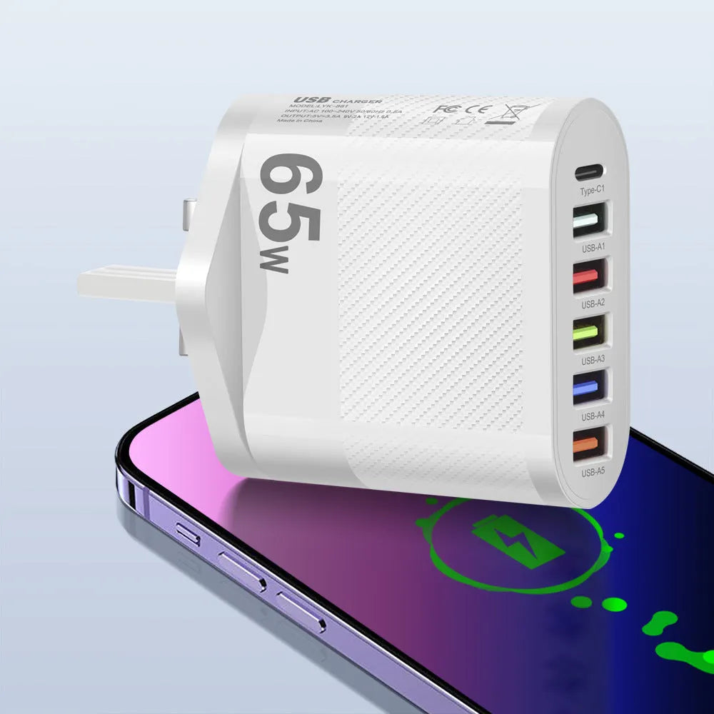 White and black mobile phone charging plugs with USB port and UK/US/EU outlet options