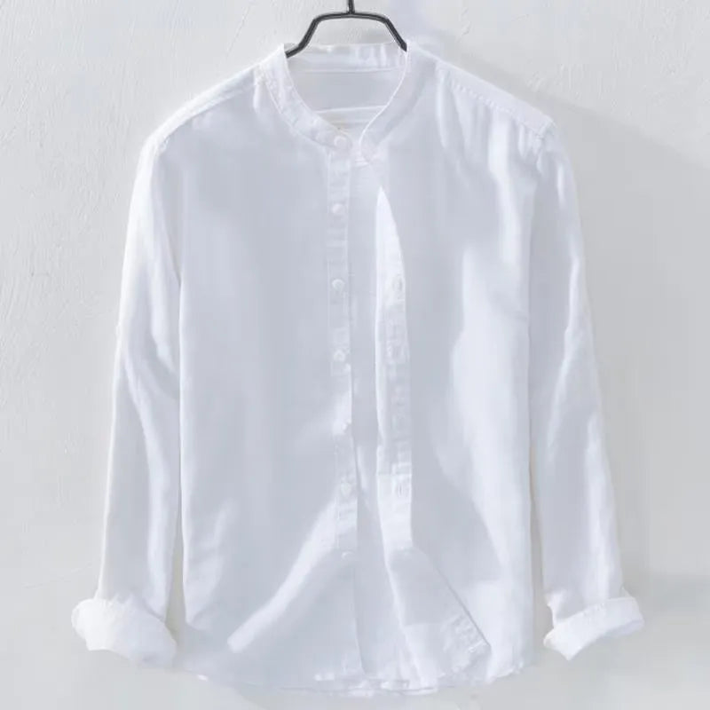 A man wearing a loose-fitting long sleeve linen casual shirt in a solid colour.
