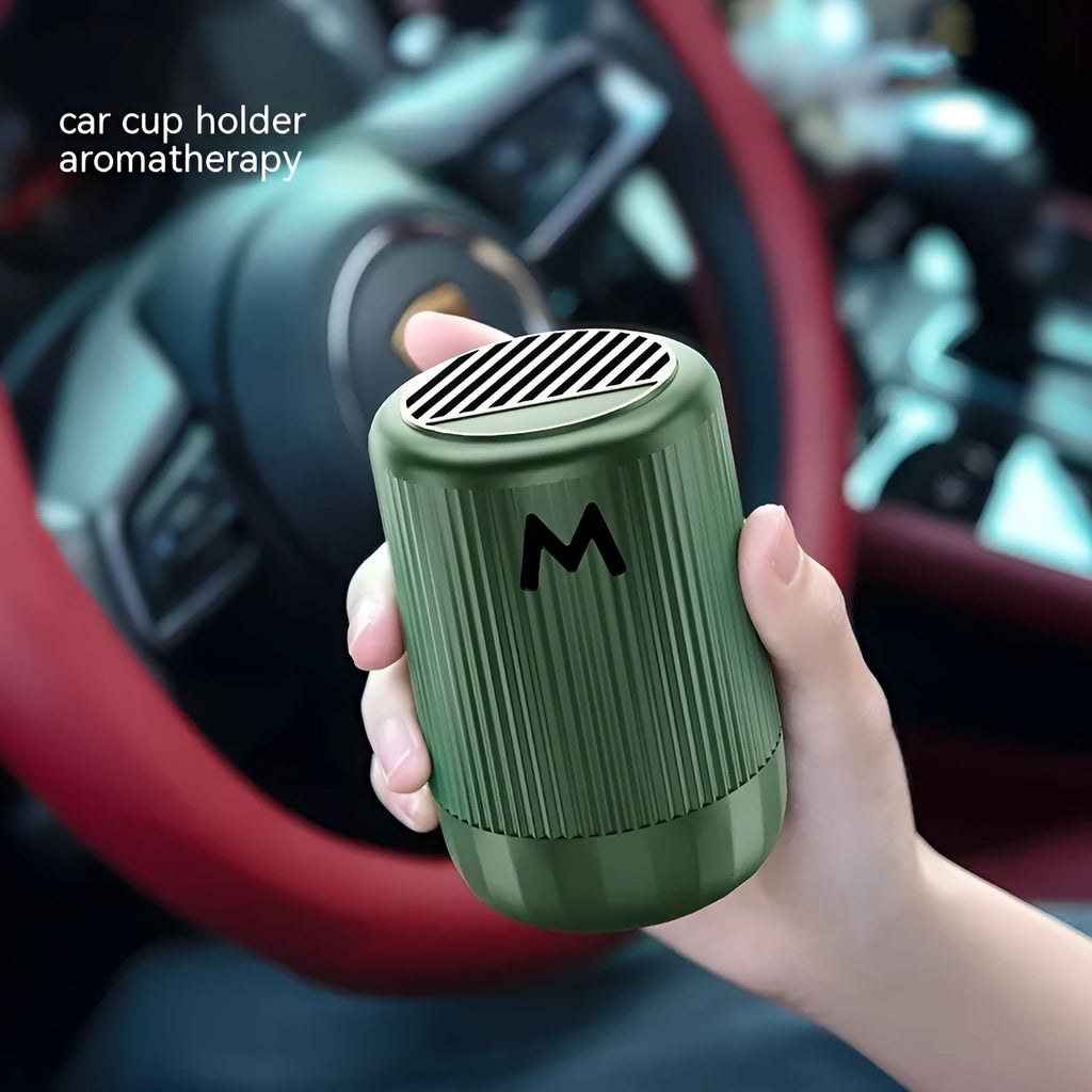 Solid car aromatherapy decoration cup in choice of four scents, measuring 10 by 6 centimetres.