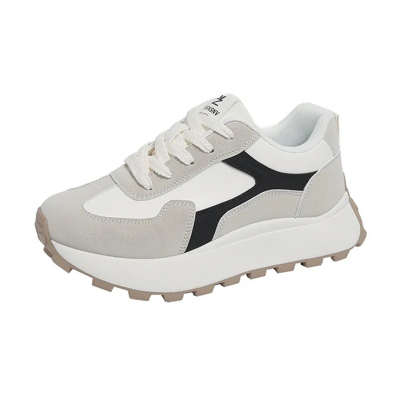 Women's solid colour platform sneakers with lace-up front and flat rubber sole.