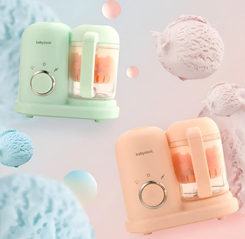 Green and pink baby food processor with steamer and blender functions, showing double mixing blades.