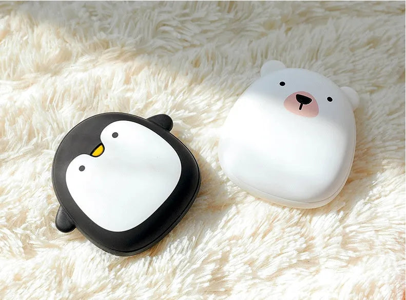 Cartoon penguin and polar bear USB rechargeable hand warmer and power bank showing double-side heating