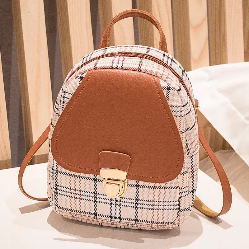 Diagonal cut one shoulder phone bag in PU fabric available in five colours.