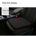 Black car seat cushion measuring 42cm wide by 39cm deep by 6cm thick