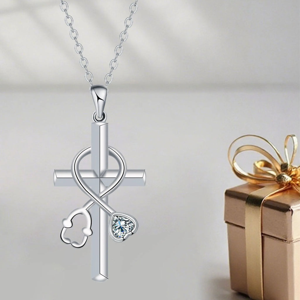 Copper cross stethoscope pendant necklace on a cross chain for women.