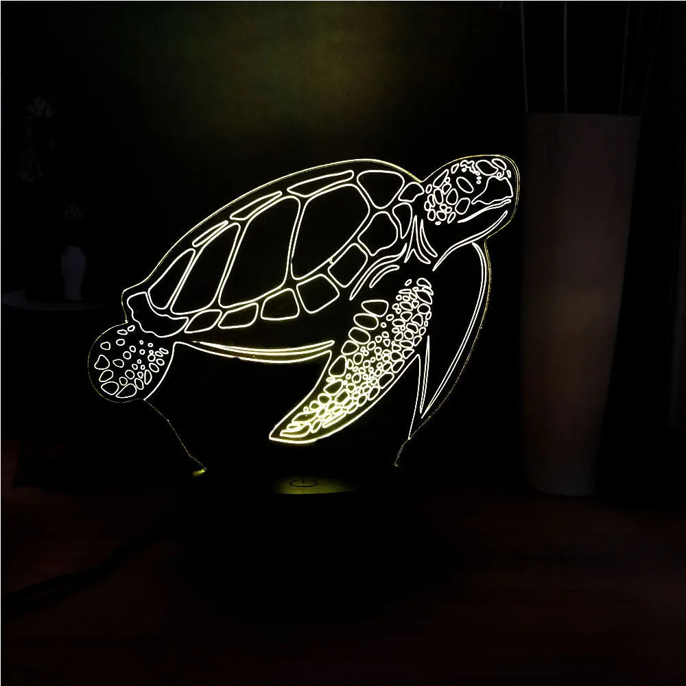 3D acrylic turtle-shaped LED night light with remote control on a shelf.