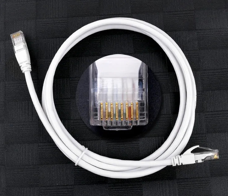 White Cat6 network cable with RJ-45 connectors on a plain background