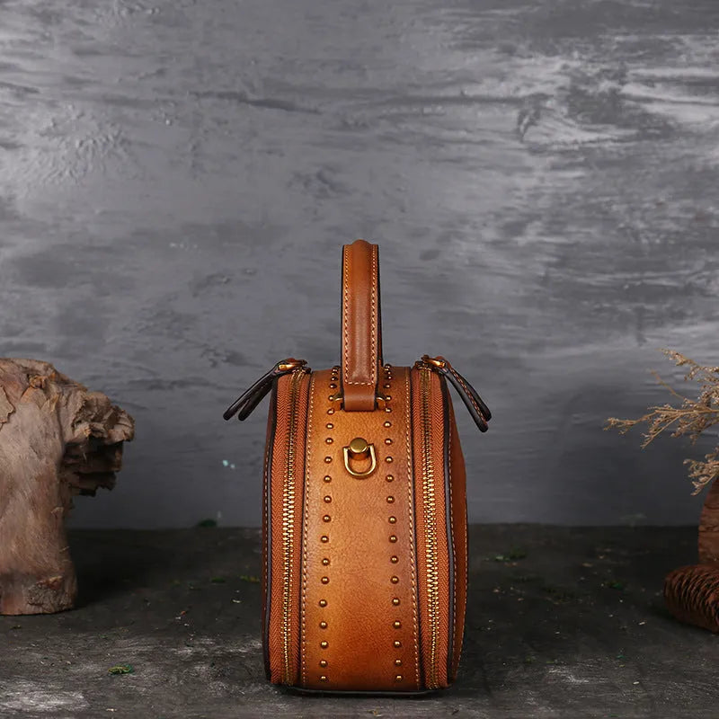 Vintage suede cowhide leather handbag with multiple interior pockets including ID and phone slots.