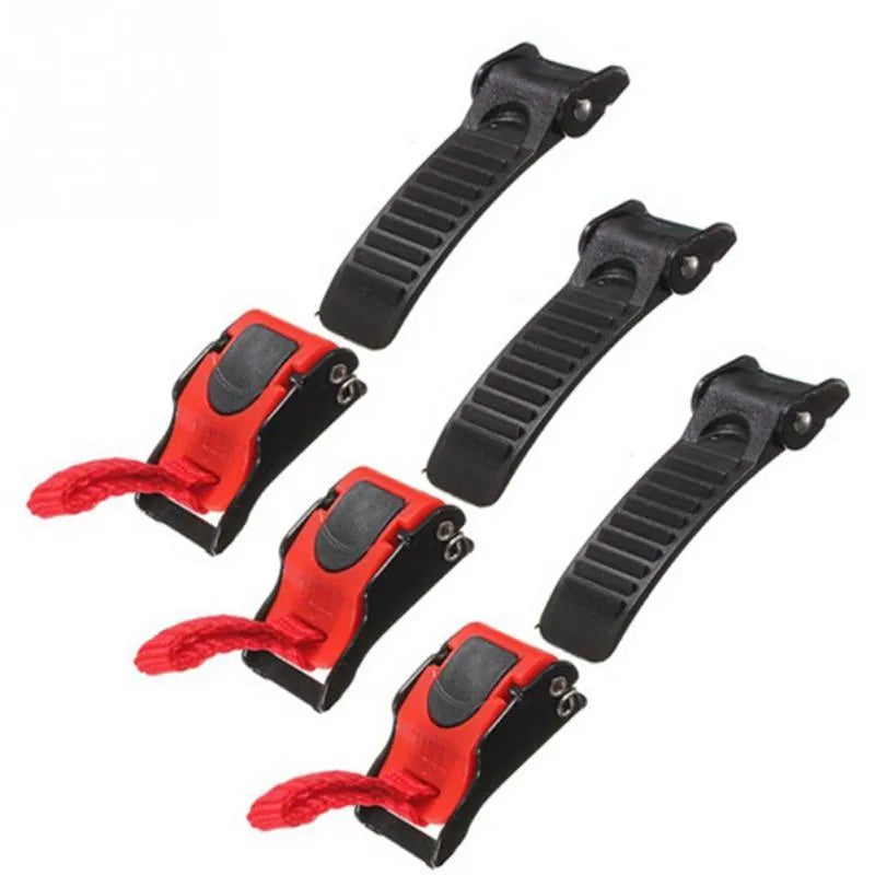 Three black and red plastic quick-release helmet chin strap buckles on white background