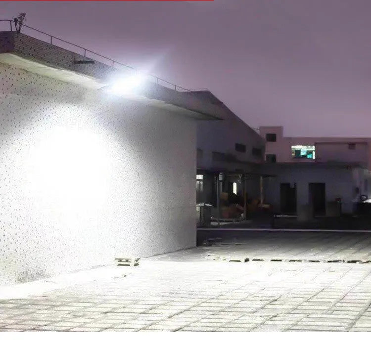 Black solar-powered outdoor motion sensor light with solar panel