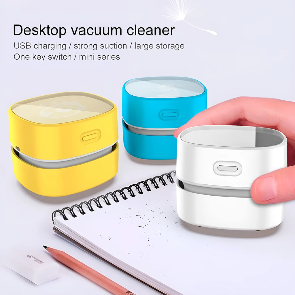 Portable handheld rechargeable mini vacuum cleaner in blue with suction nozzle on a white background