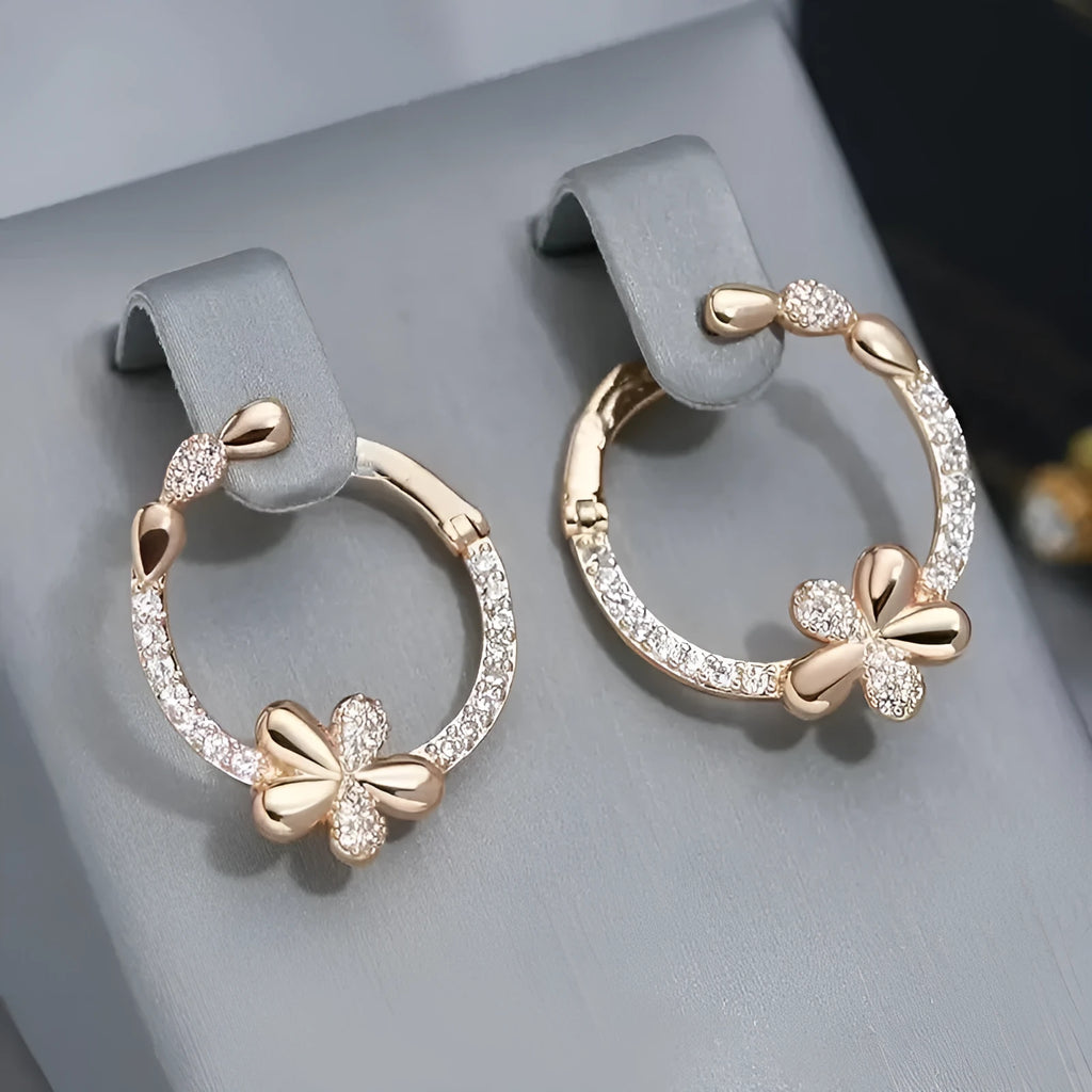 A pair of women's round geometric ring earrings in copper with an electroplated EK13286-FD-01 colour finish.
