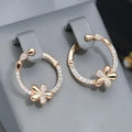 A pair of women's round geometric ring earrings in copper with an electroplated EK13286-FD-01 colour finish.
