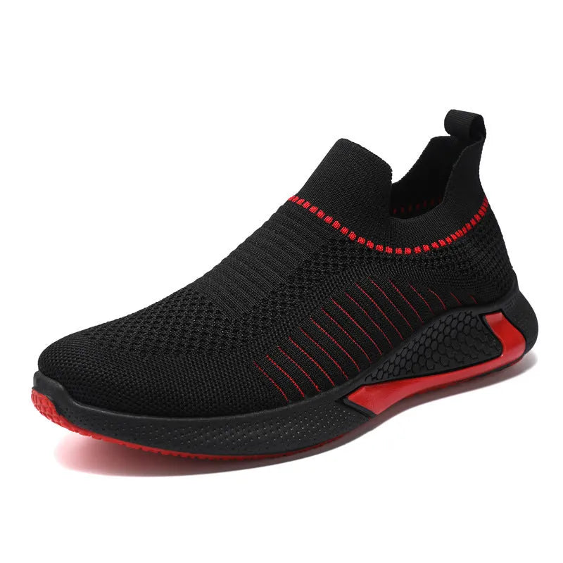 Men's black and white Flyknit mesh sneakers with lace-up front on a flat sole.