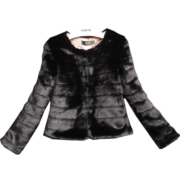 A woman wearing a short white faux fur top with regular sleeves, layered over a black long-sleeve top.