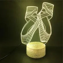 Ballet dancer 3D LED night light with remote control on a table.