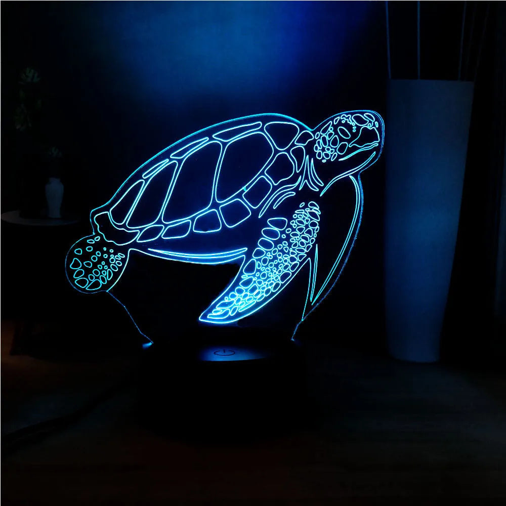 3D acrylic turtle-shaped LED night light with remote control on a shelf.