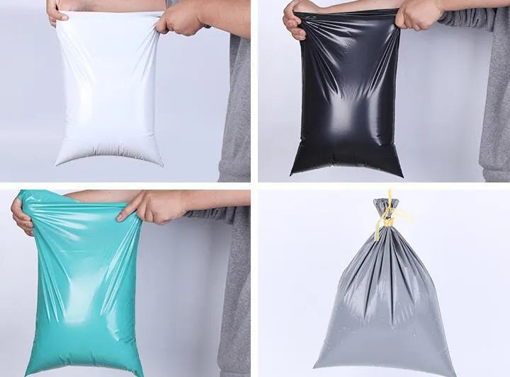 A bundle of 100 clear PE courier bags for clothing in multiple sizes, sealed with stickers.