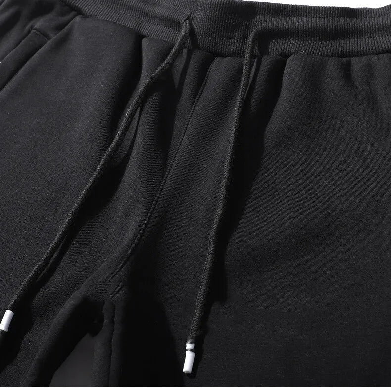 Men's casual loose straight-leg cotton-look sweatpants with fleece lining in black, front view