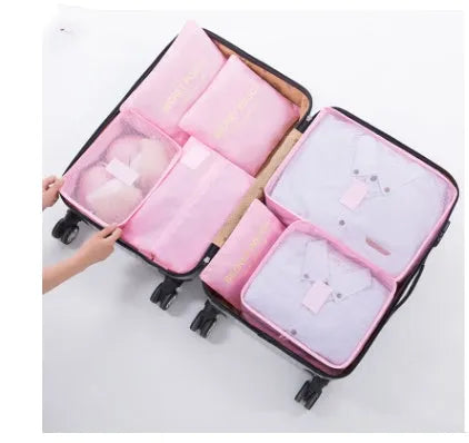 Set of six waterproof nylon packing cube organisers in different sizes and colours, with mesh panels.