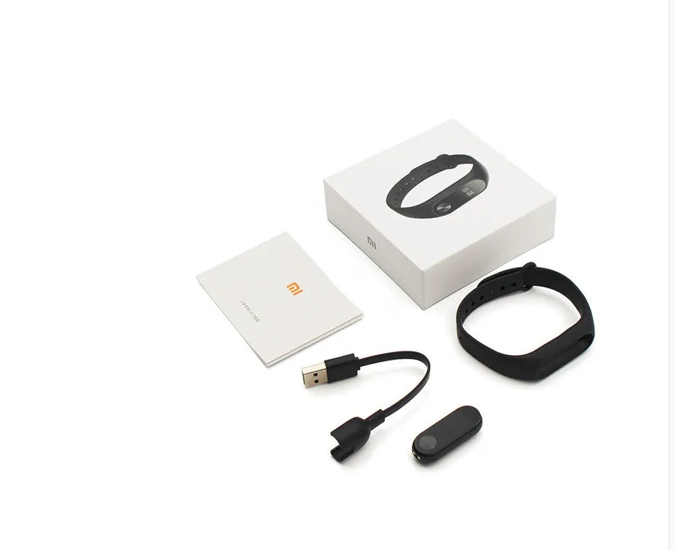 Xiaomi Mi Band 2 black smart band with OLED screen on an adjustable grey wrist strap.