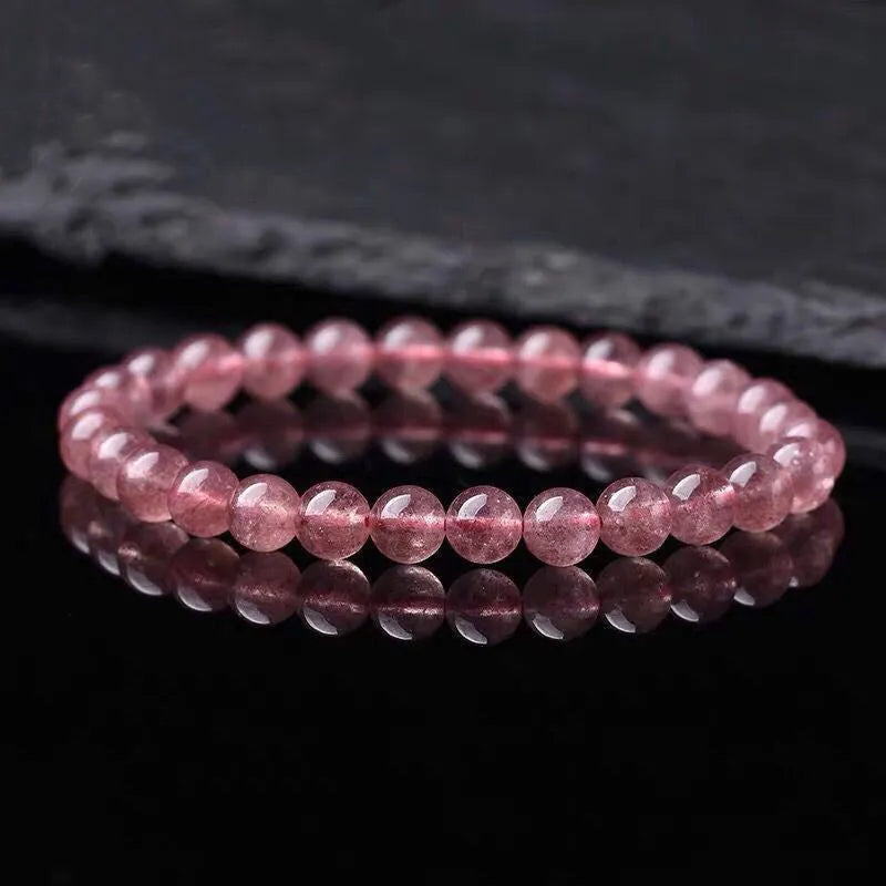 Women's strawberry quartz bracelet with polished crystal beads in choice of 6mm, 8mm or 10mm sizes