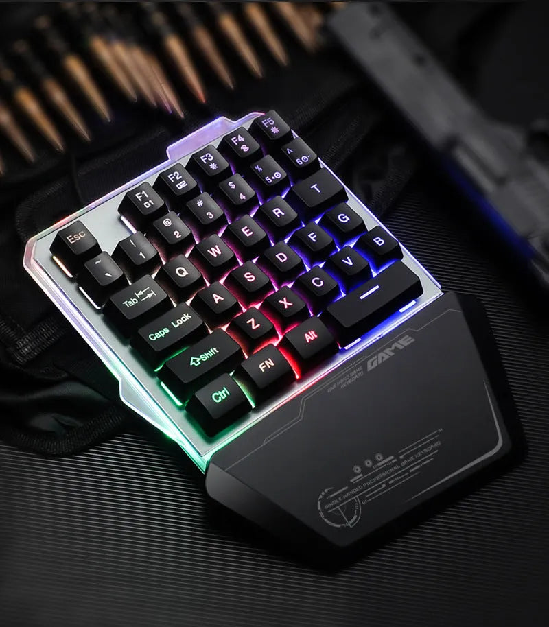 Black G40 Flow one-handed mechanical keyboard with RGB backlit keys on a desk