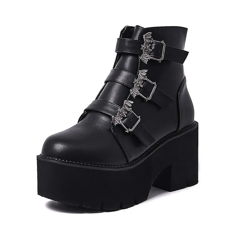 Black women's punk gothic ankle boots with a bat buckle and side zipper on a thick sole.