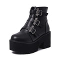 Black women's punk gothic ankle boots with a bat buckle and side zipper on a thick sole.