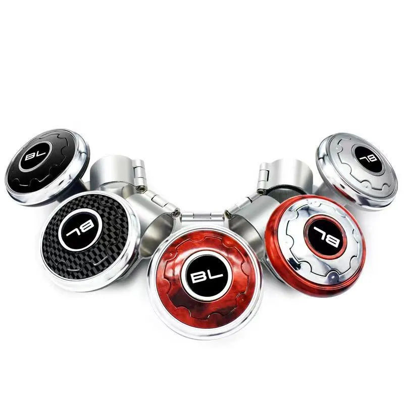 Universal metal steering wheel assist knob with steel ball bearing, shown in black, silver, carbon fibre, electroplating and wood grain colour options