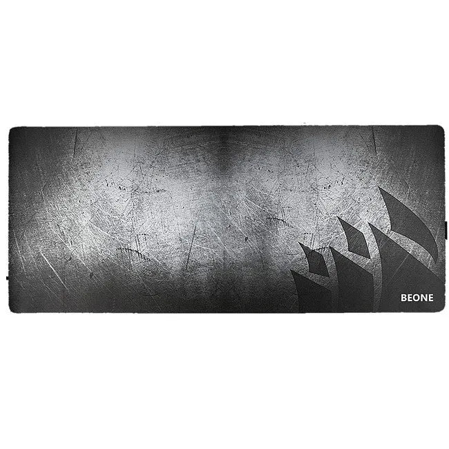 Black thickened non-slip mouse pad with rubber base and cloth surface on a desk