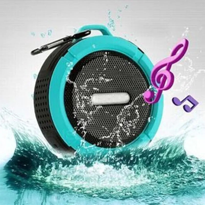 Compact waterproof Bluetooth speaker with a mounting strap in black, blue, green, red, or yellow.