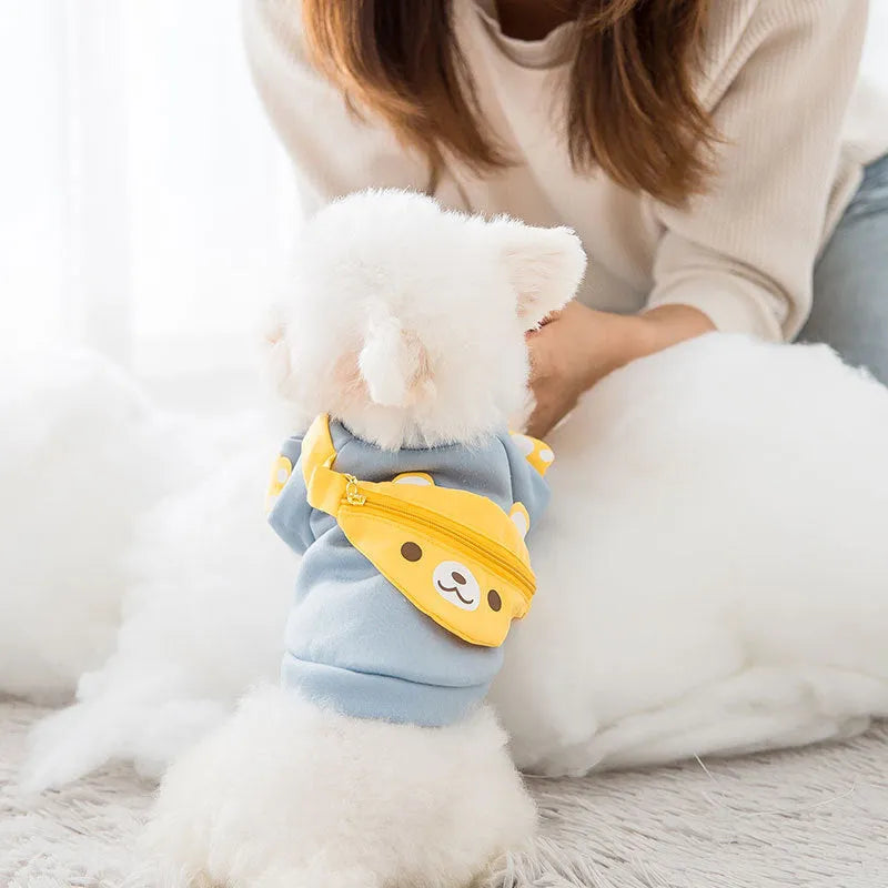 Blue cartoon backpack pet clothes milk silk sweater on small dog in side view