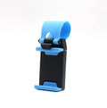 Black steering wheel phone clip holder mounted on car wheel showing phone placement