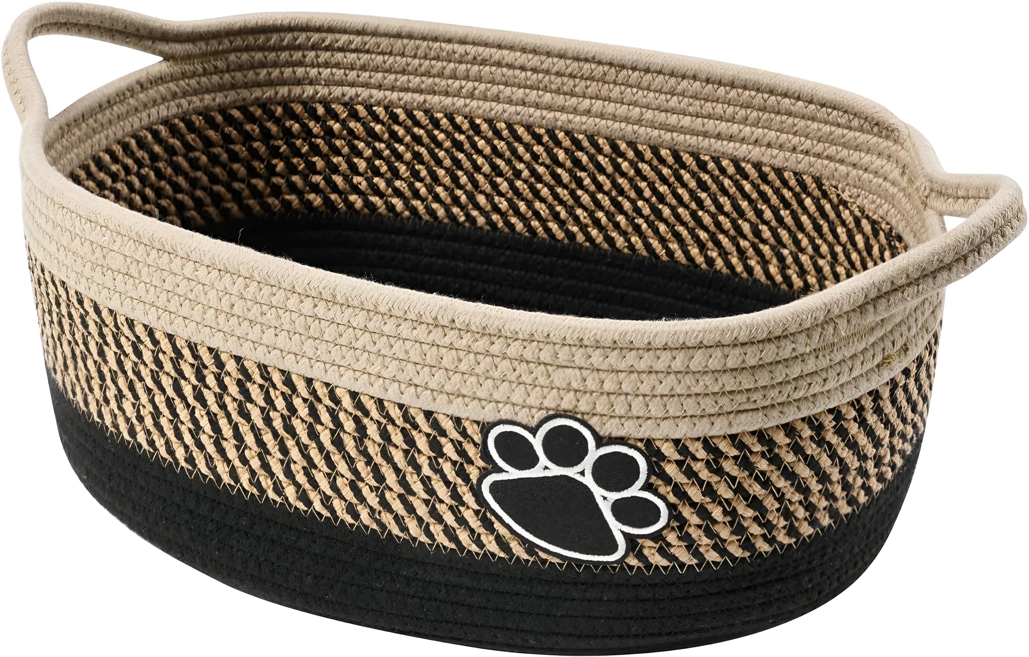Light beige handmade cotton rope storage basket with handle on a wooden surface.