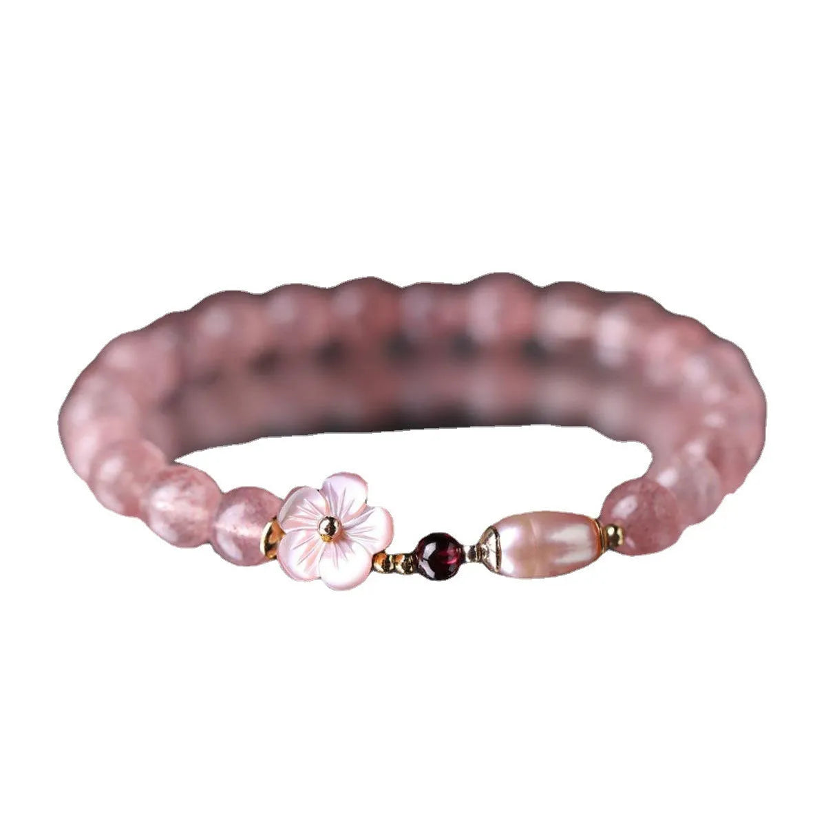 Light pink strawberry quartz crystal bracelet with peach blossom floral design and adjustable fastening