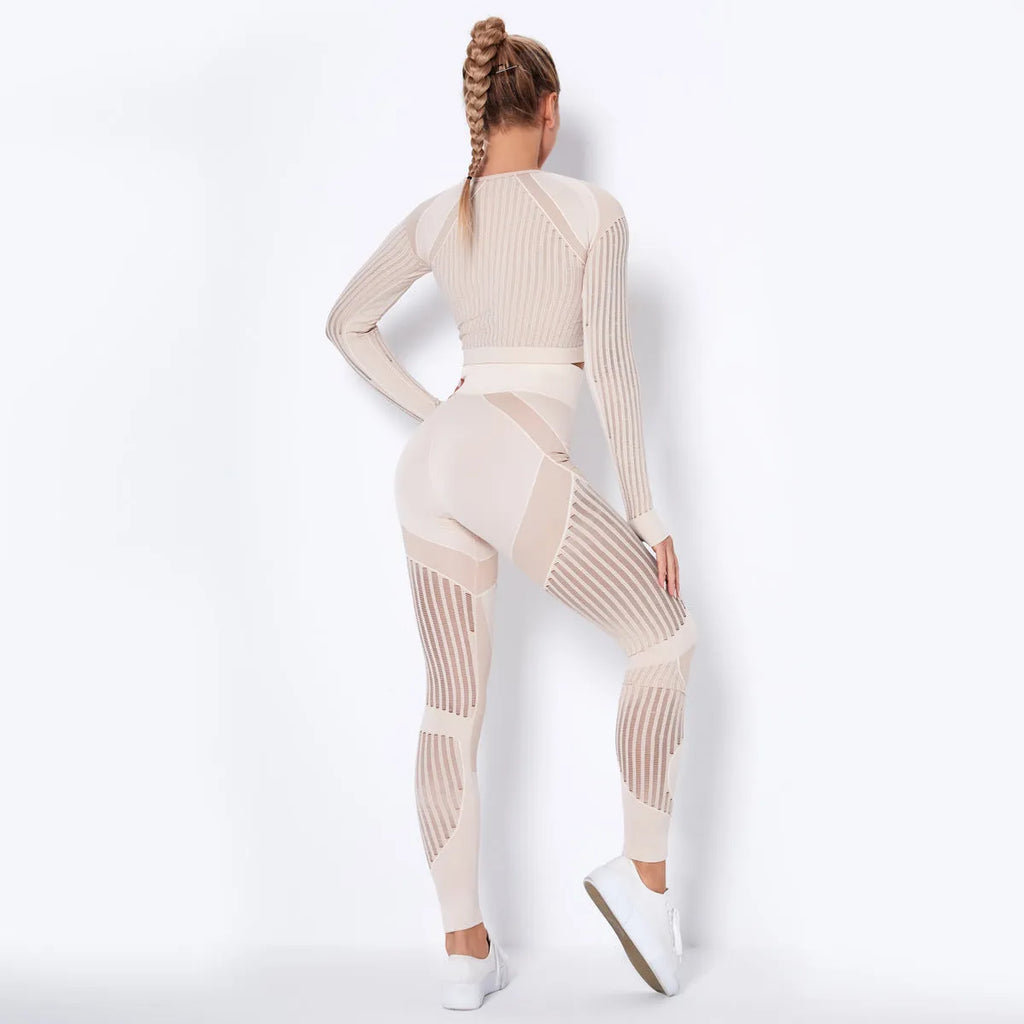 Women's long-sleeved seamless yoga wearsuit in a dark colour, shown in a yoga pose.