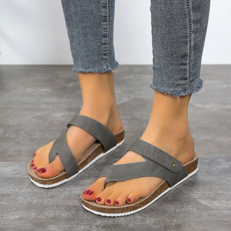 Flat toe ring thick-soled flip-flops in blue, showing foam sole and PU upper.
