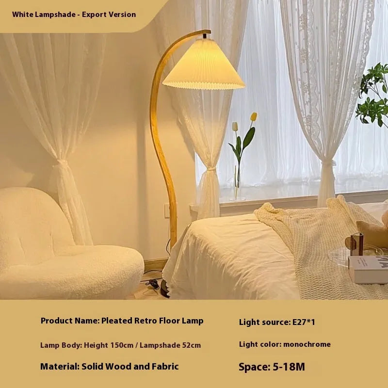 Retro vertical table lamp with a choice of log white or wine red shade, placed on a sofa arm.