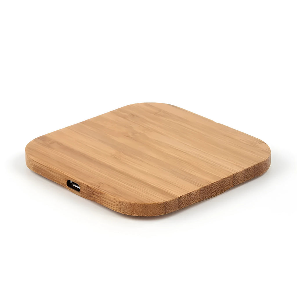 Square wooden bamboo 5W wireless charging pad on a table.