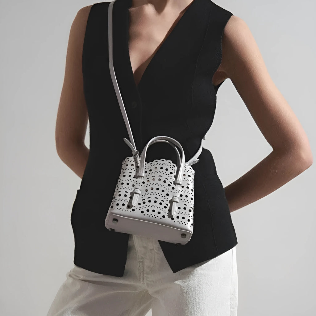 Hollow carved square messenger bag in PU with three shoulder straps