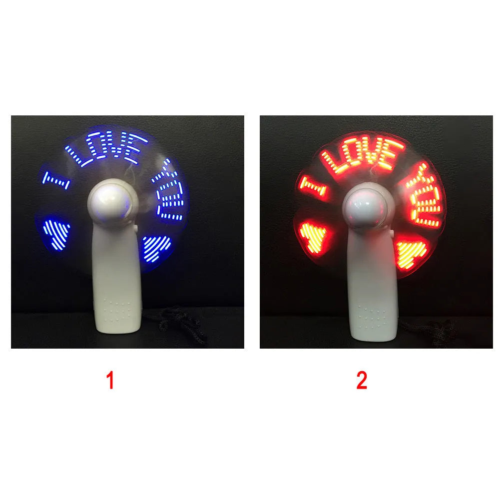 White handheld mini fan with flashing blue and red LED 'I Love You' pattern on display.