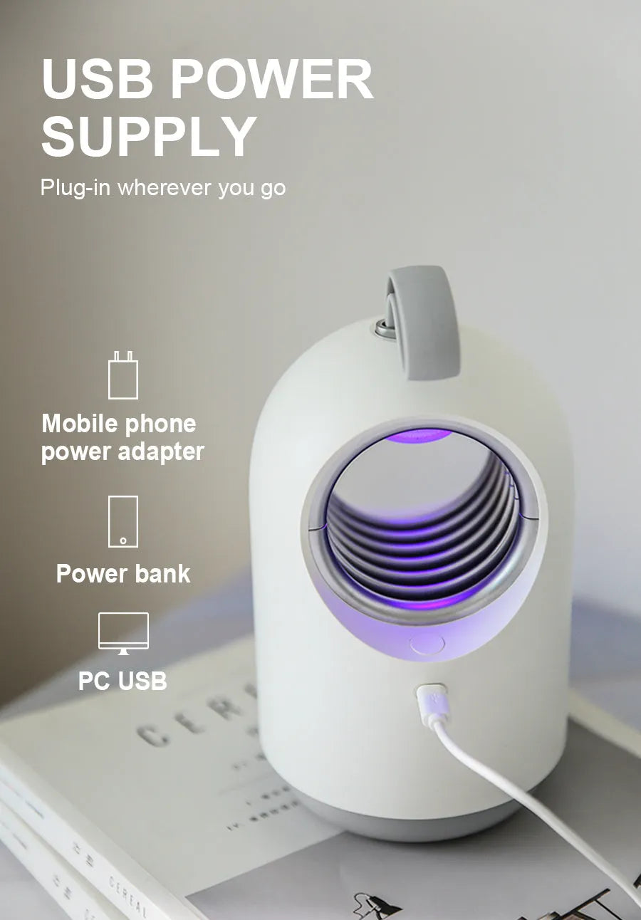 White or blue indoor mosquito killer lamp with UV light, suction fan, silicone handle, and USB cable.