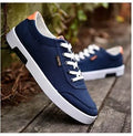 Men's Korean-style low-top canvas shoes, lace-up closure, rubber sole, plain pattern with car suture detail, available in sizes 39-44