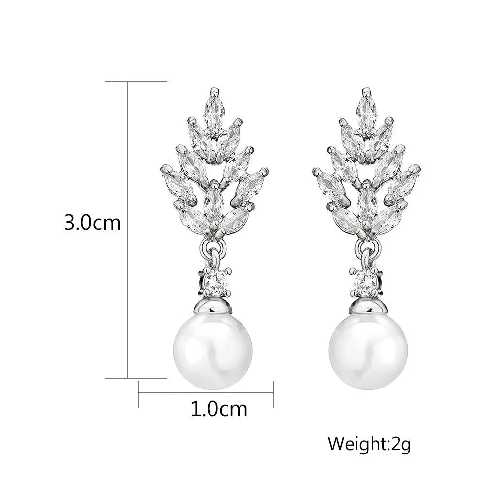 Gold plated geometric earrings with micro inlaid zircon stones in a floral design.